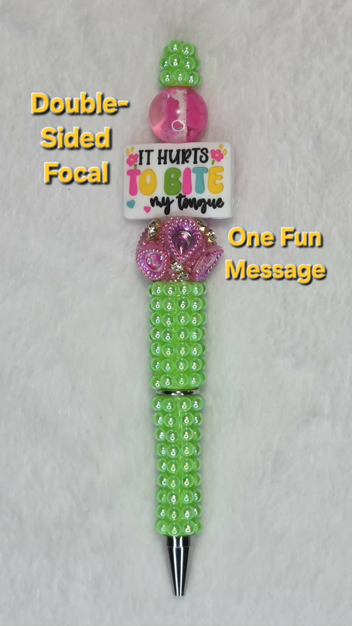Bite My Tongue Beadable Pen showing It Hurts to Bite My Tongue focal side with neon green barrel