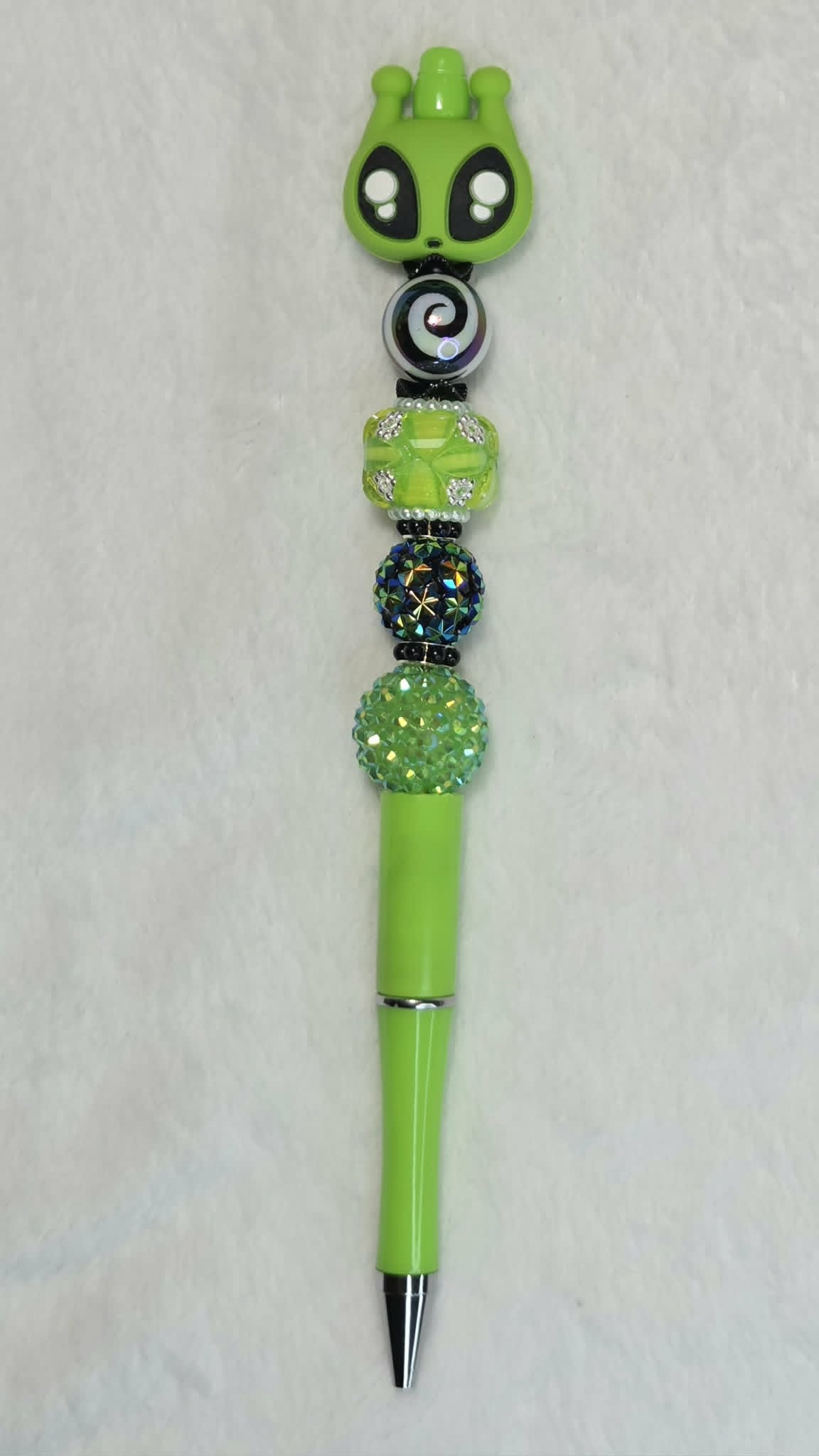 Mesmerizing Alien Beadable Pen with alien head focal, hypnotic swirl bead and lime green barrel