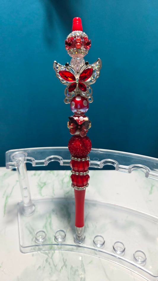 Butterfly Folly Red Beadable Pen with rich red crystal butterfly charm and layered red rhinestone beads