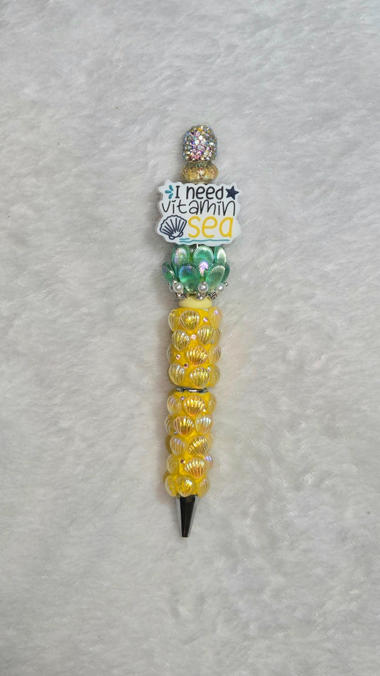 I Need Vitamin Sea Beadable Pen – handmade tropical beach beaded pen with yellow shell beads and vitamin sea charm