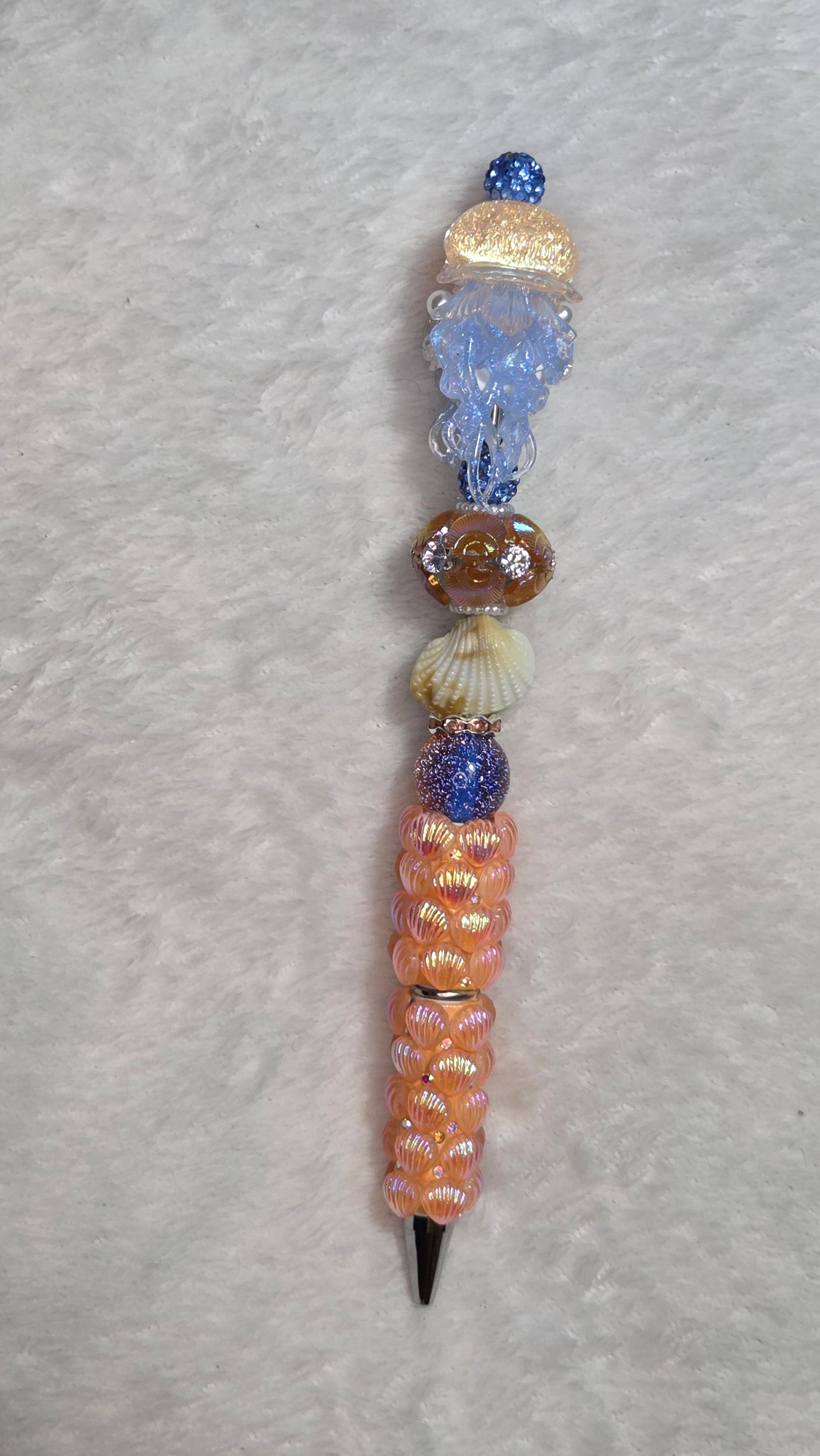 True Blue Jellyfish Beadable Pen – handmade peachy coral tropical beach beaded pen with blue jellyfish focal and gold cap